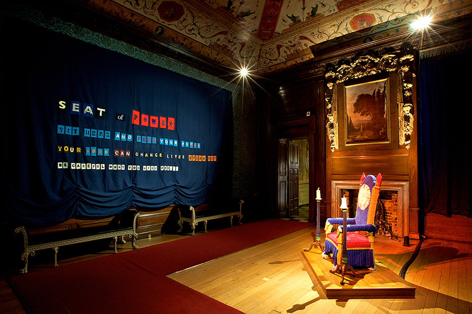Immersive museum exhibition exploring power and authority inside a historic royal interior, using theatrical staging and artistic interpretation. (Photo courtesy of Wildworks.)