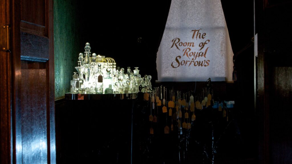 Immersive art installation in Queen Mary II’s bedchamber, transformed into the Room of Royal Sorrows through light, mirrors, and sensory interpretation. (Photo courtesy of Wildworks.)