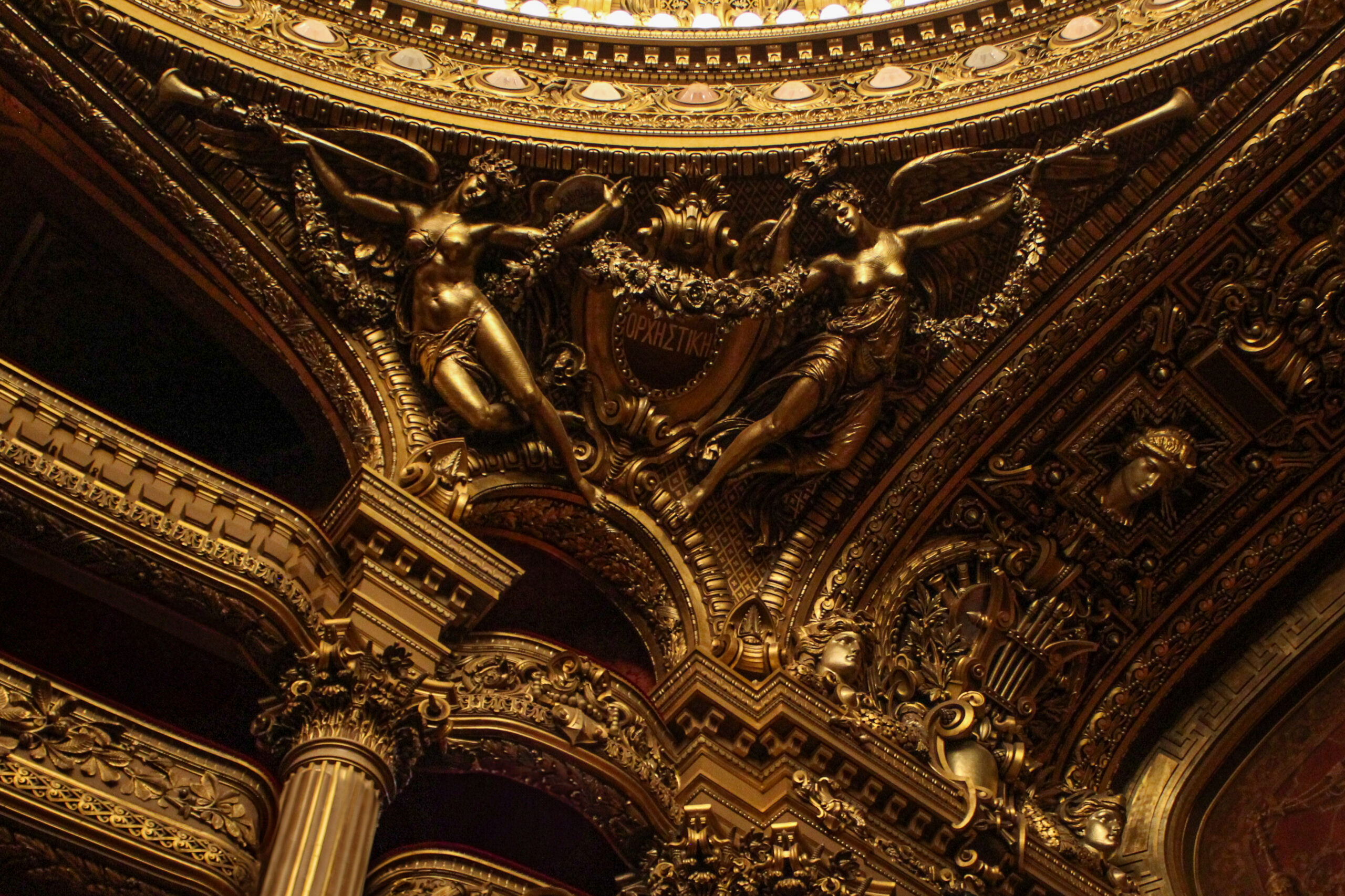 Detail from the Auditorium. Muses with flower garlands and horns, detail from the auditorium of the Paris Opera House. Photo by Everhart Creative.