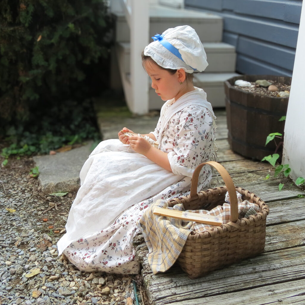 Young artisan practicing colonial craft, Colonial Maryland.