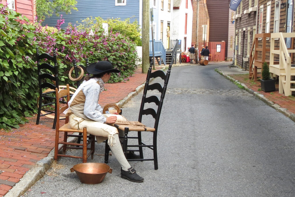 Colonial craftsman at work on Pinkney Street, Revolutionary Annapolis.