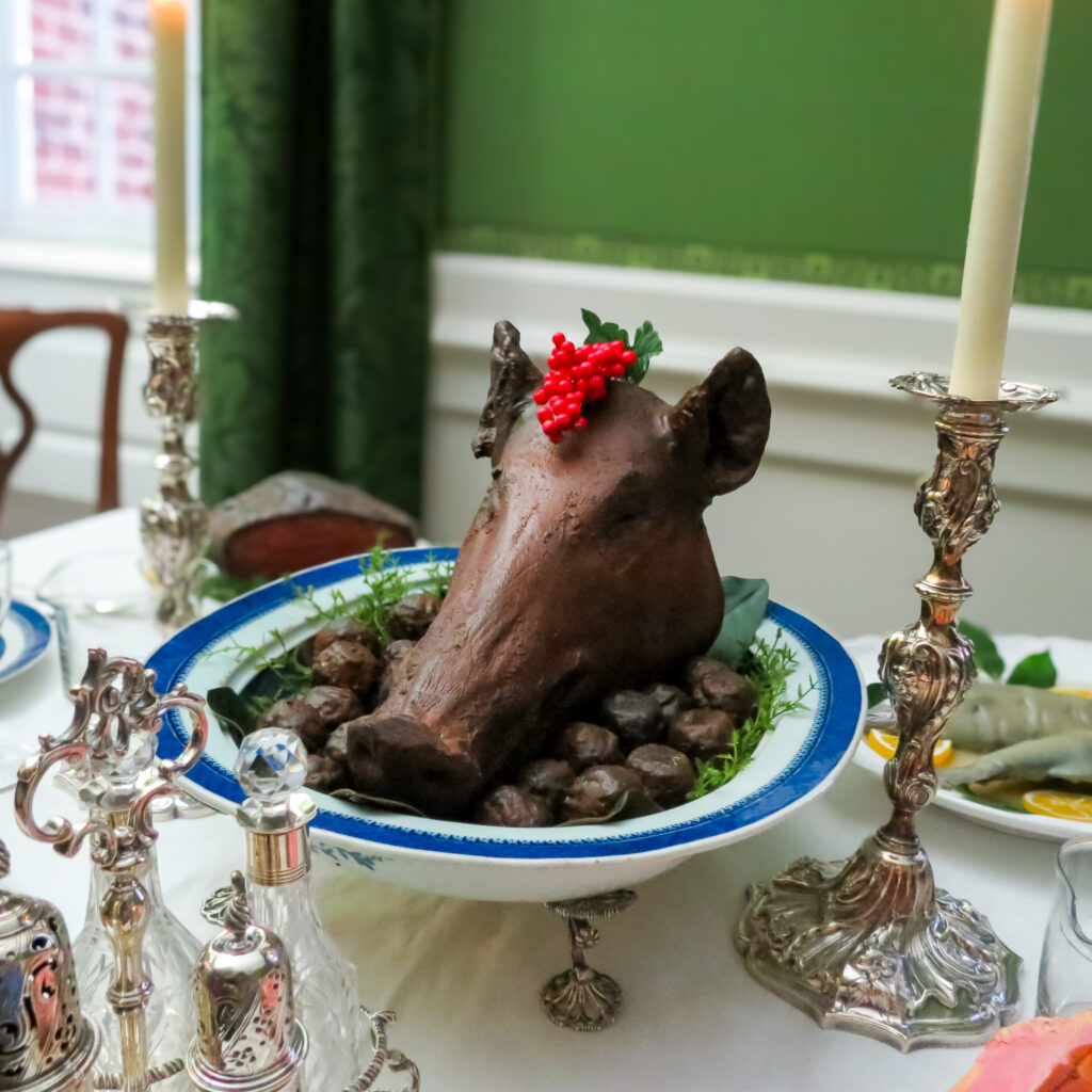 The Holiday Centerpiece. A roast pig’s head anchors the holiday table. 2025.