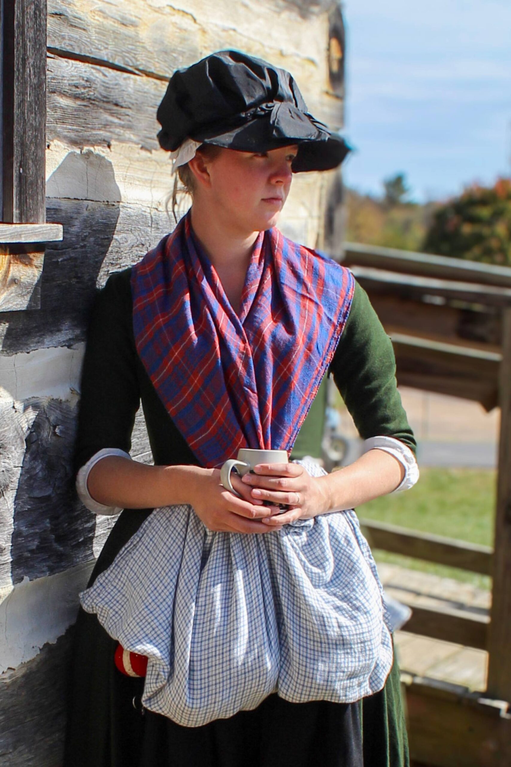 Living history photography image of an 18th-century follower of the British Army in period dress.