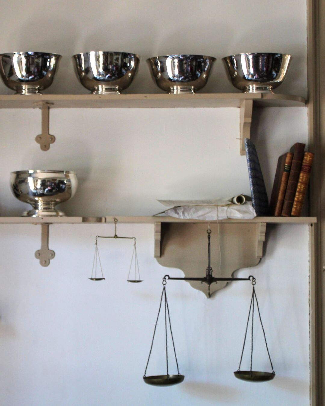 Engravers’ shelves at Colonial Williamsburg, captured in living history photography to highlight tools and materials of the trade.