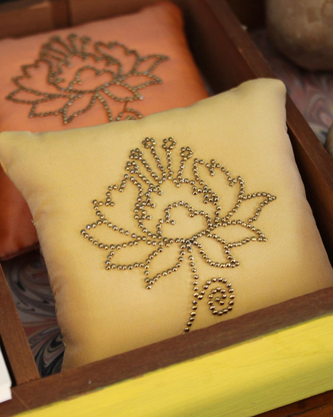 Close-up detail of pin cushions.