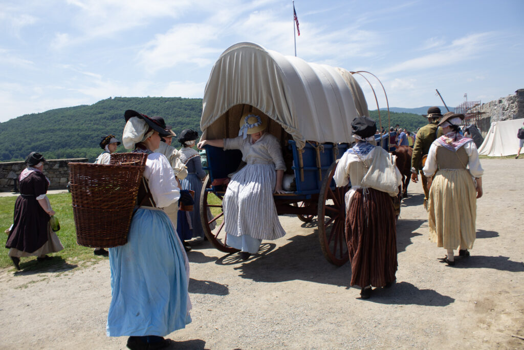 Camp followers accompany the Conestoga wagon at Fort Ticonderoga, Ticonderoga, NY. 2026.